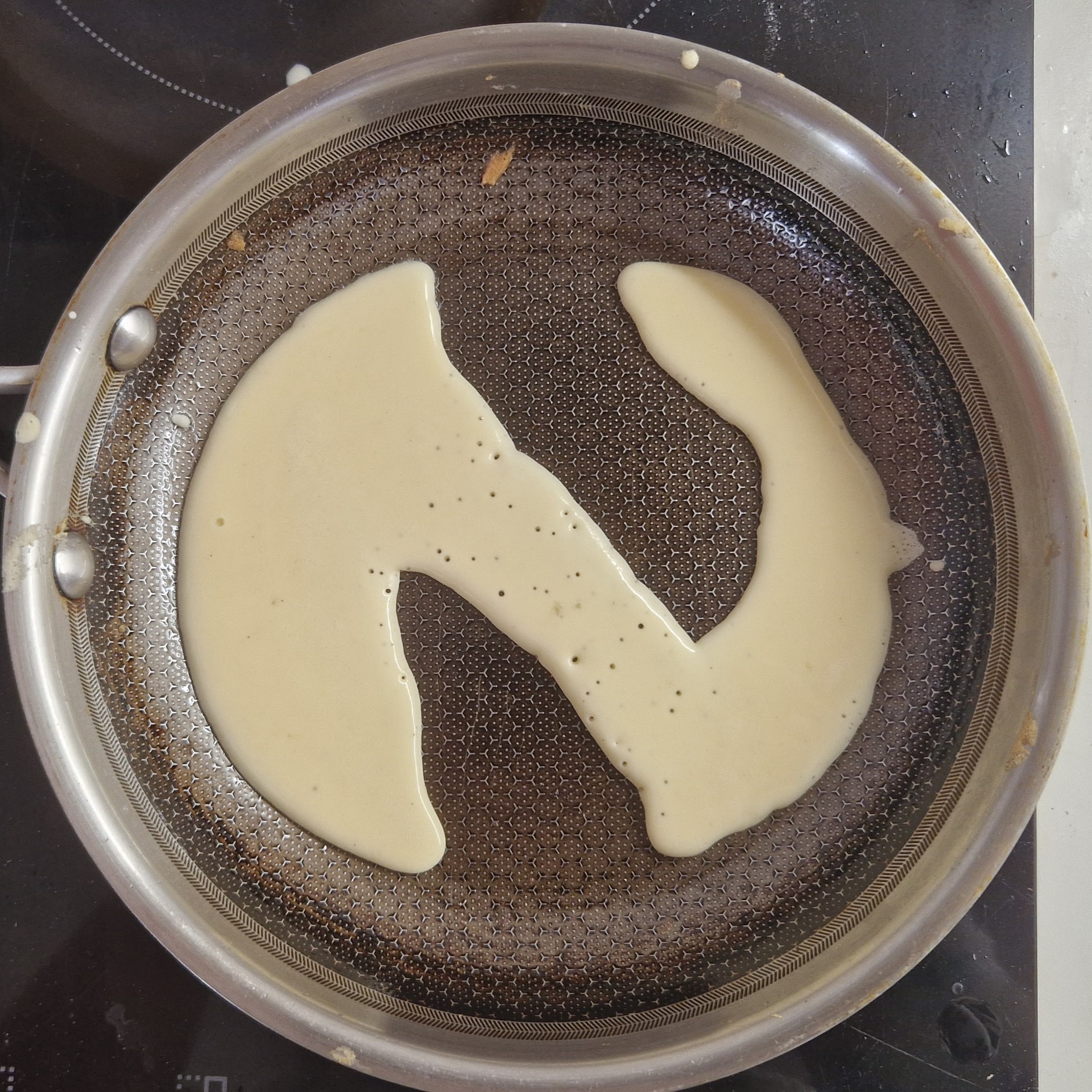 Further into making of pancakes, this one formed into N